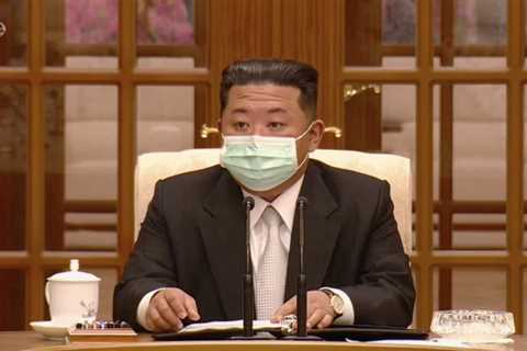 Masked Kim Jong-un FINALLY admits Covid is in North Korea as he plunges country into full lockdown