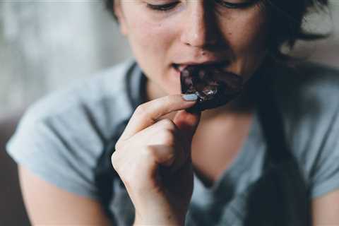 Chocolate bars and packets of crisps should be made SMALLER to help Brits lose weight, Government..