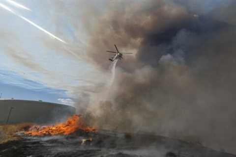 Fires rage, power grid tested by Southern California heat wave