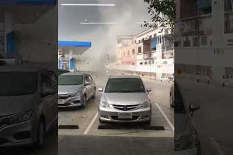 People run for cover as tornado rips through petrol station in Thailand