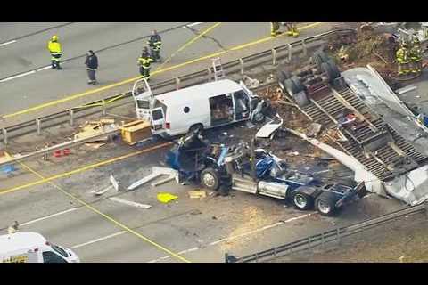 Tractor-trailer falls from highway overpass onto van below