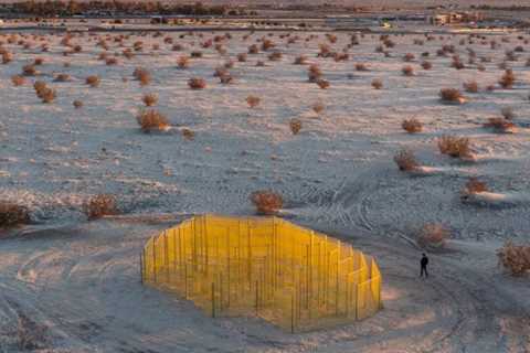 Desert X 2023 incorporates a sculpture product of piled practice vehicles