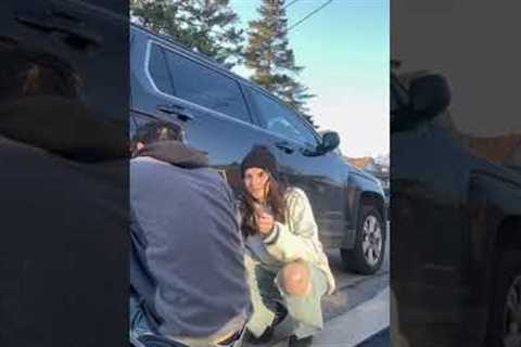 Guy regrets asking girlfriend help with changing tire