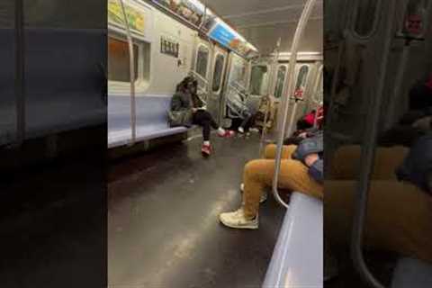 Commuters play soccer with dropped orange on subway