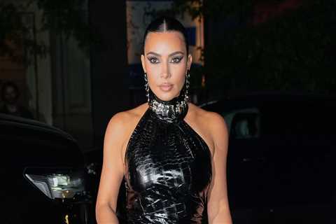 Kim Kardashian wears a skintight black vinyl dress to dinner in New York