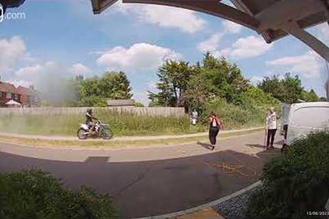 Shocking moment biker speeding along sidewalk almost hits young boys