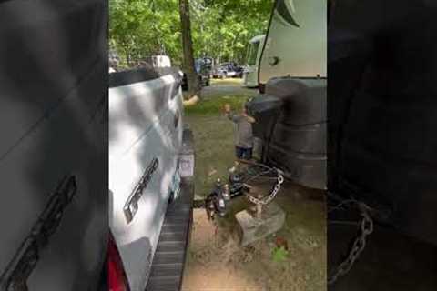 Tiny expert helps his dad align trailer hitch