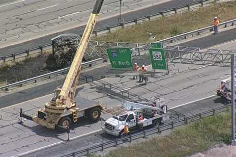 Crews work to fix sign downed on I-30