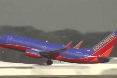 Southwest Airlines attendants picket at Orlando International airport for better pay, work quality