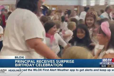 Elementary School in Biloxi surprises principal for 50th birthday with sock-hop celebration