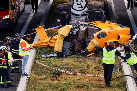 Helicopter crashes on busy motorway in Spain and hits a car after ‘being tossed by strong winds’