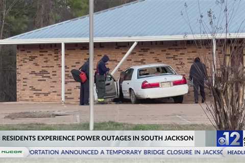 Car crashes into Jackson building, causes outage