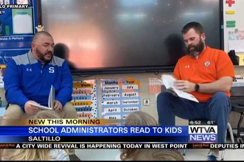 Two school administrators at Saltillo Primary School try to get students excited about reading