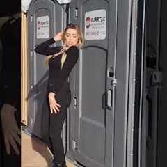 Influencer posing against porta potty get hit by door when occupant kicks it open
