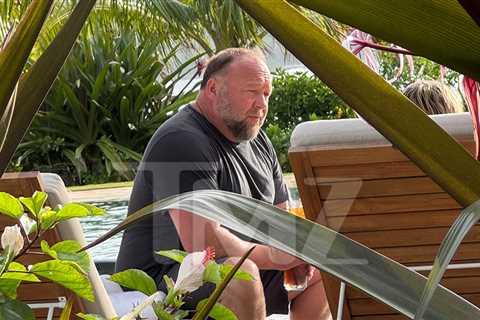 Alex Jones Relaxing in Hawaii, Still Owes Millions to Sandy Hook Families