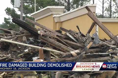 Burned building being torn down on Highway 18