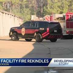 Fire at storage facility rekindles