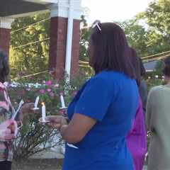 Care Lodge hosts candlelight vigil to honor domestic  violence victims